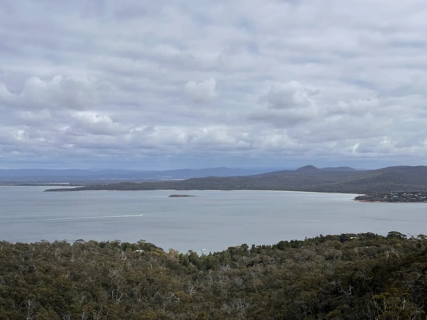 Great Oyster Bay panorama with boat wake from above Coles Bay