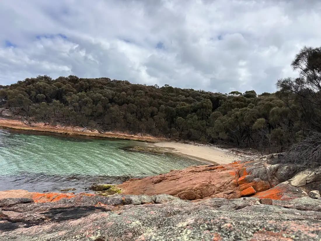 Honeymoon Bay with orange lichen granite and turquoise water