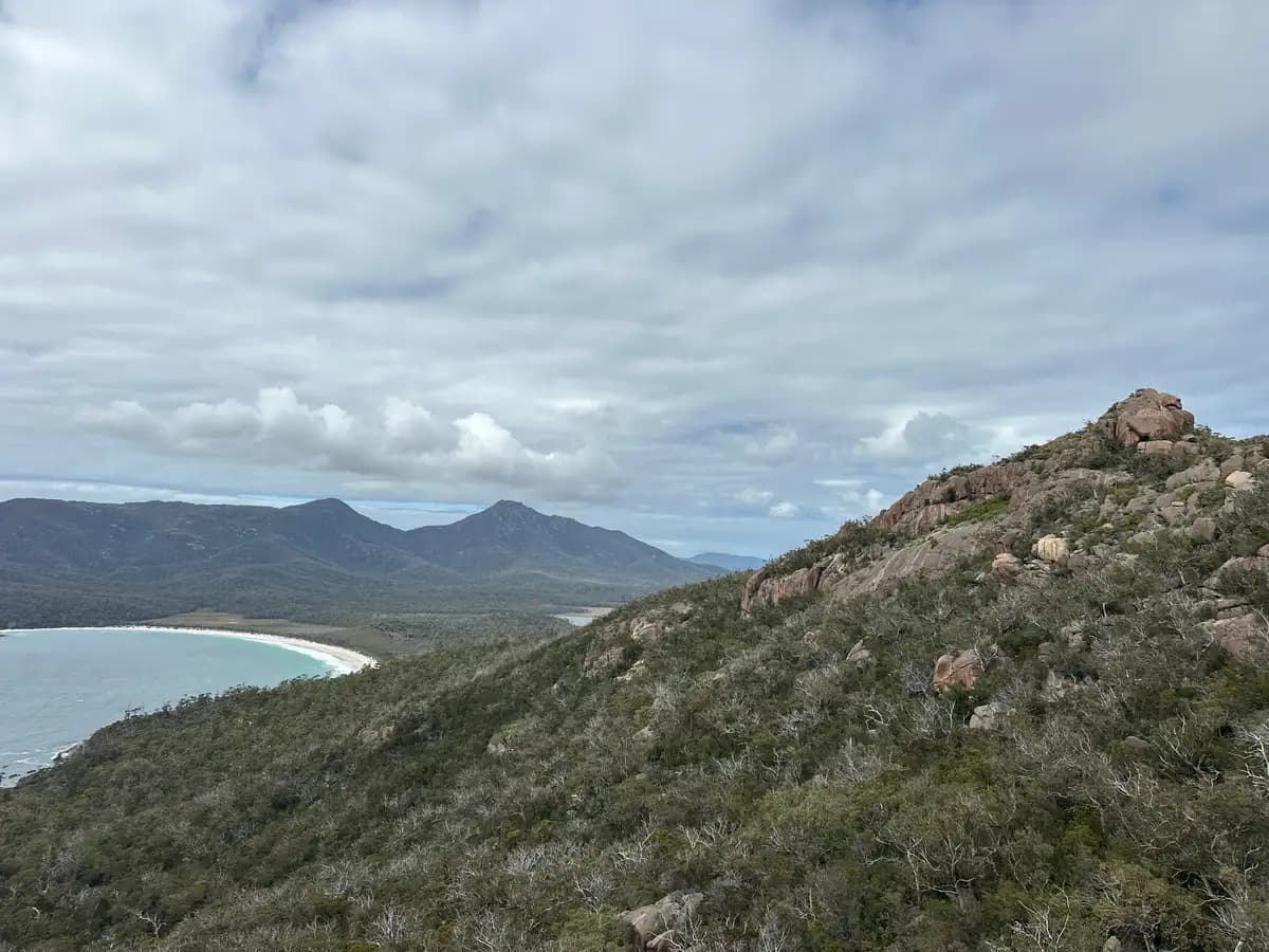 Wineglass Bay coastline with Mount Amos summit and coastal scrubland