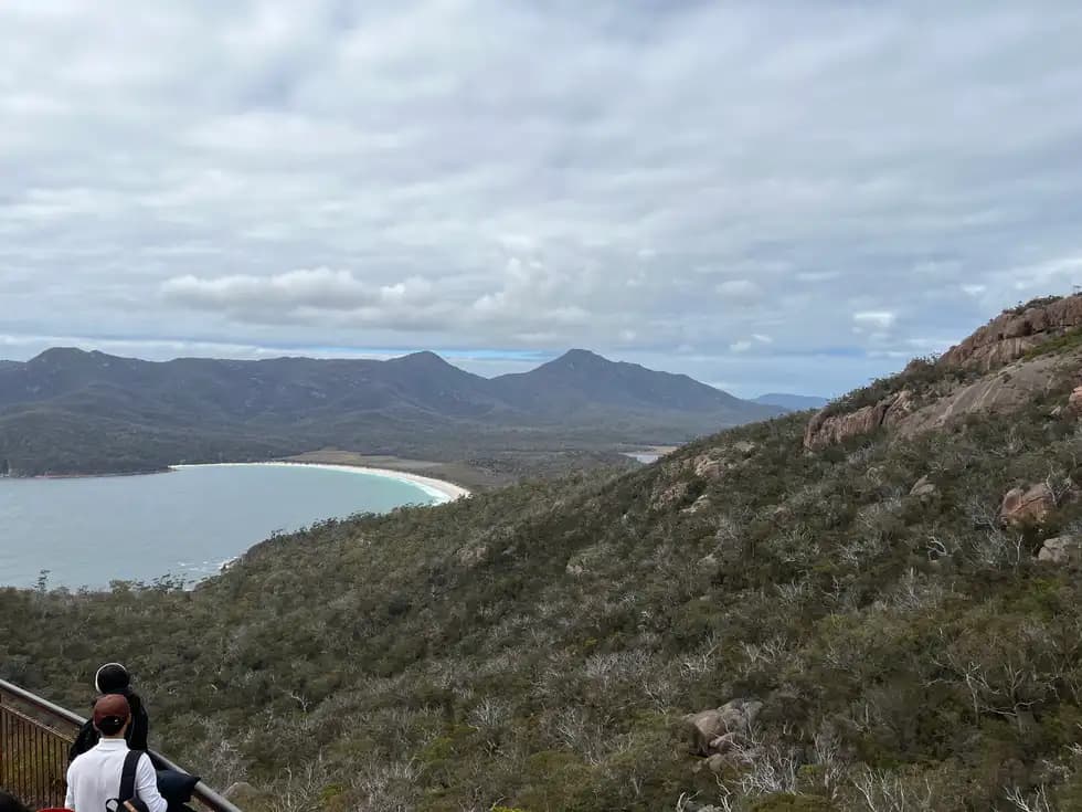 Wineglass Bay viewed from the lookout platform with The Hazards and turquoise waters