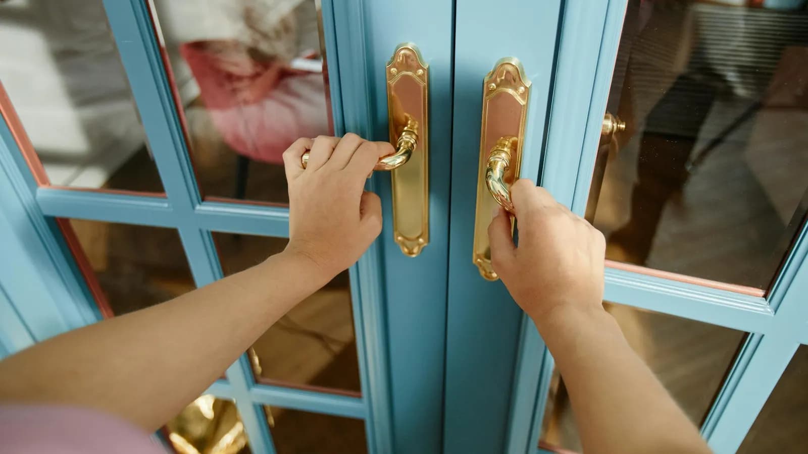 A person holding a door open, a small act of everyday courtesy.